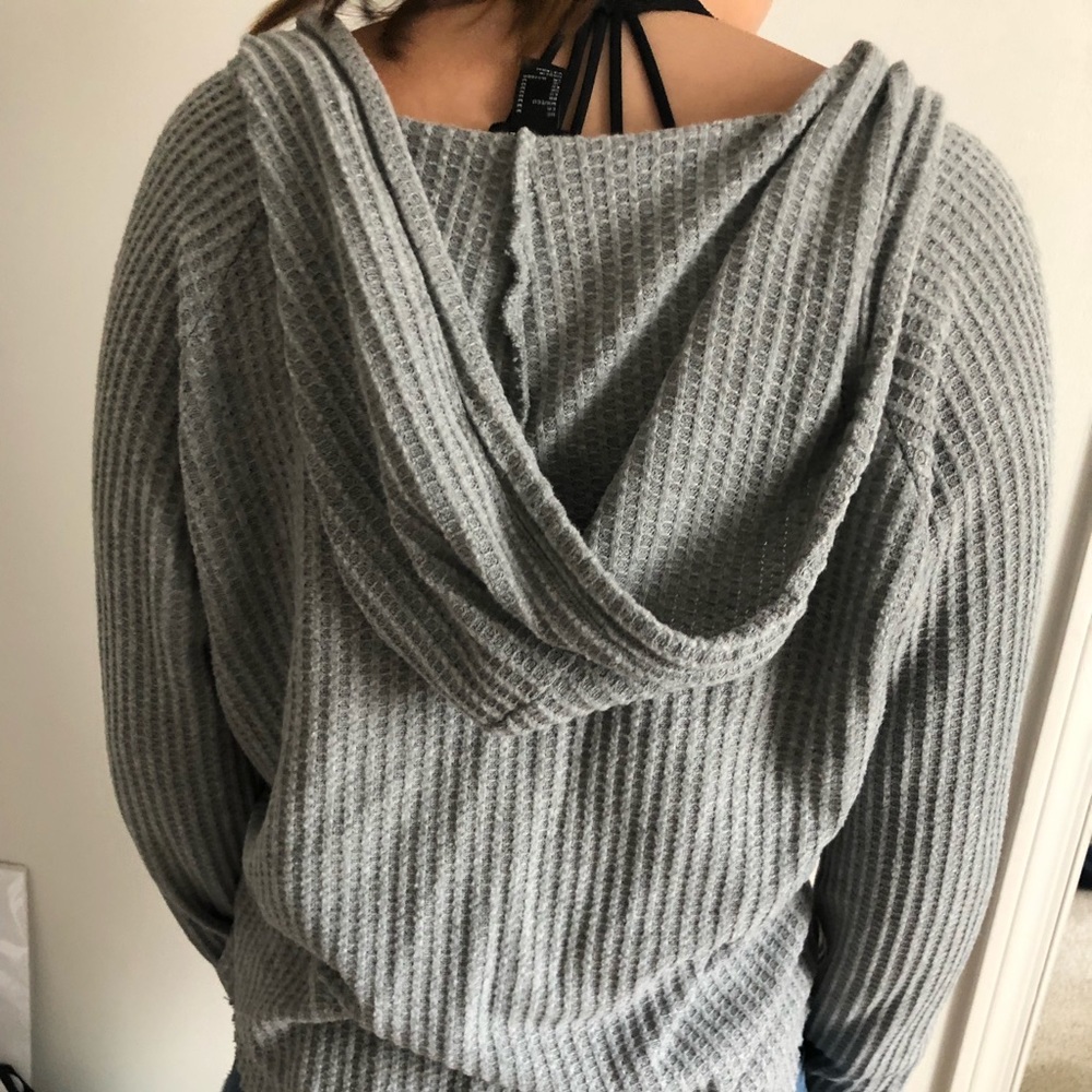 A grey sweater